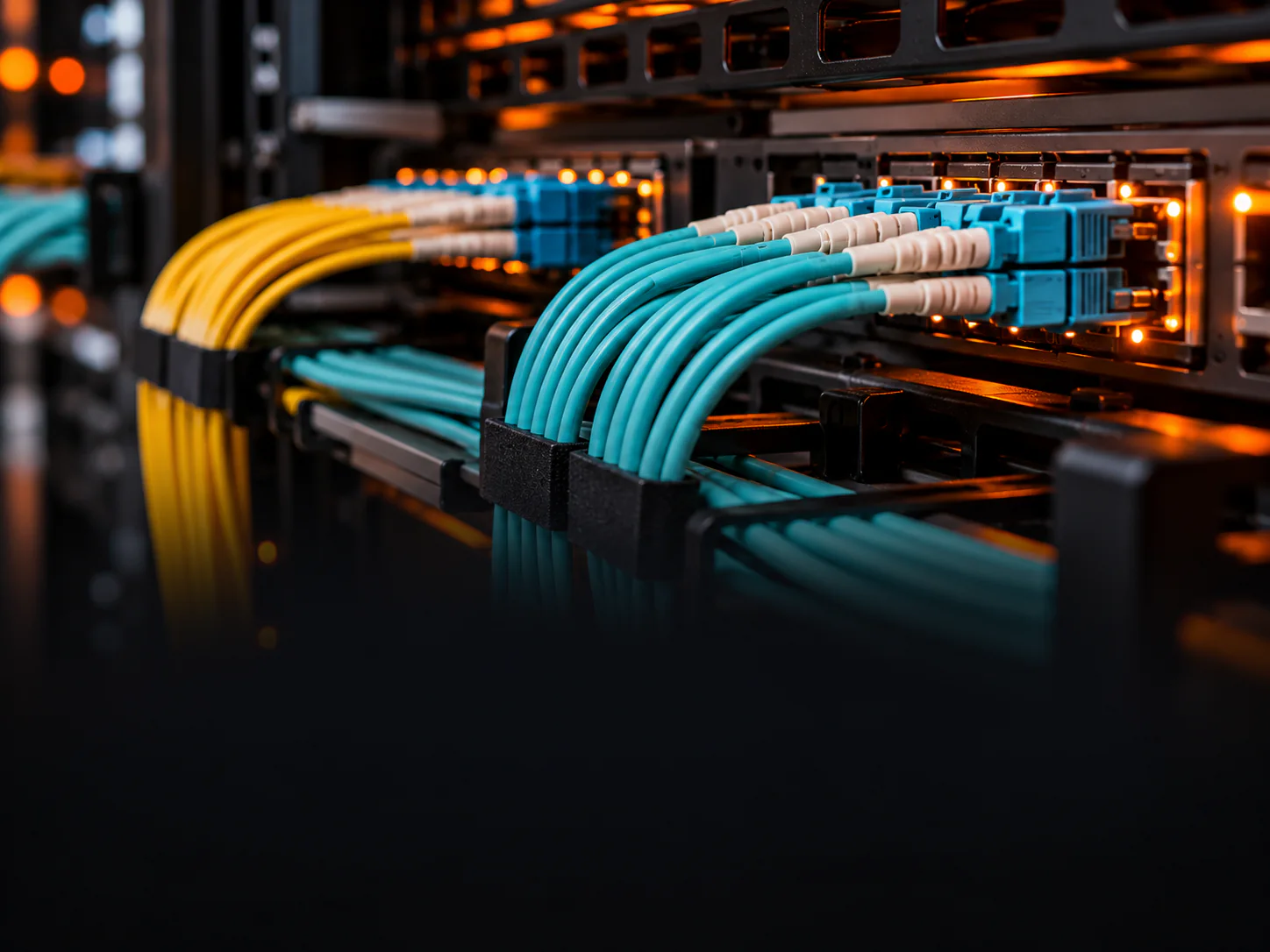 Neatly organised structured cabling and fiber patch cords in a rack