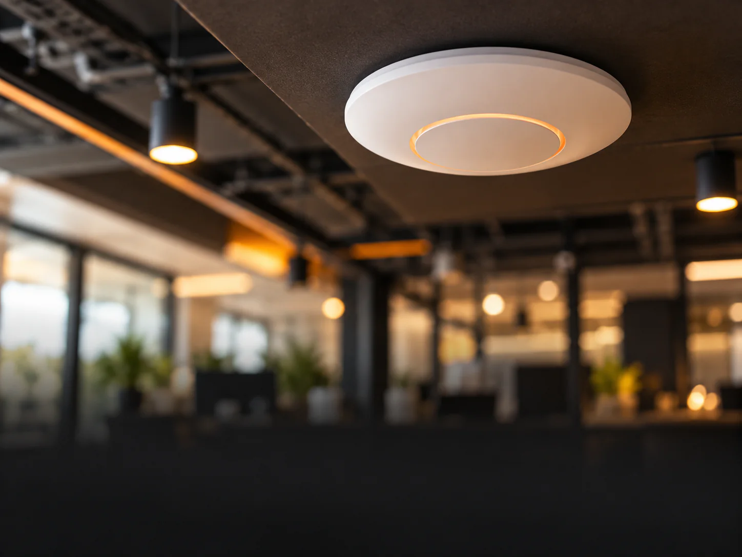 Ceiling-mounted Wi-Fi access point in a modern office